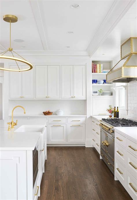 black granite white cabinets gold pulls stainless steel appliances|gold knobs and pulls.